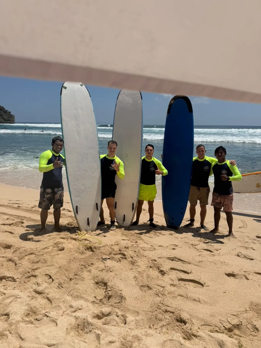 NASA Surf School team with surfboards on Balangan Beach