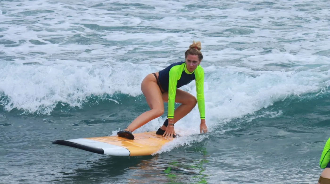 Surfer progressing during a NASA Surf School lesson