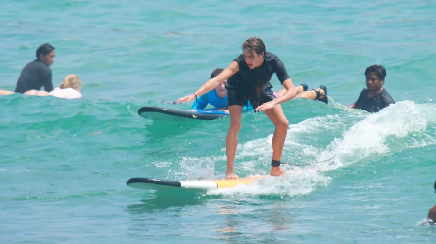Surfer practising in the Balangan Beach waves